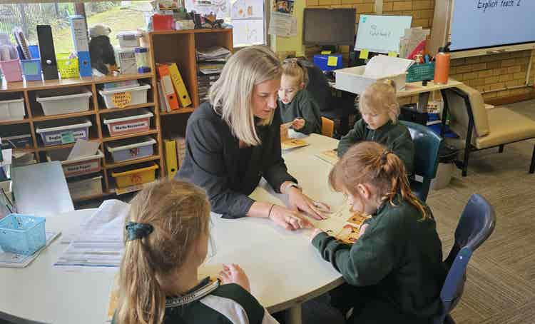 teacher working with small group of students