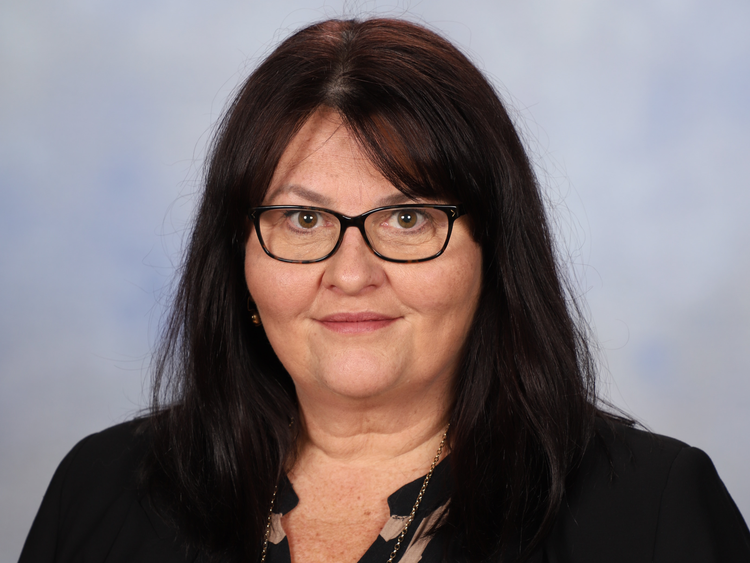 a person in black shirt wearing glasses